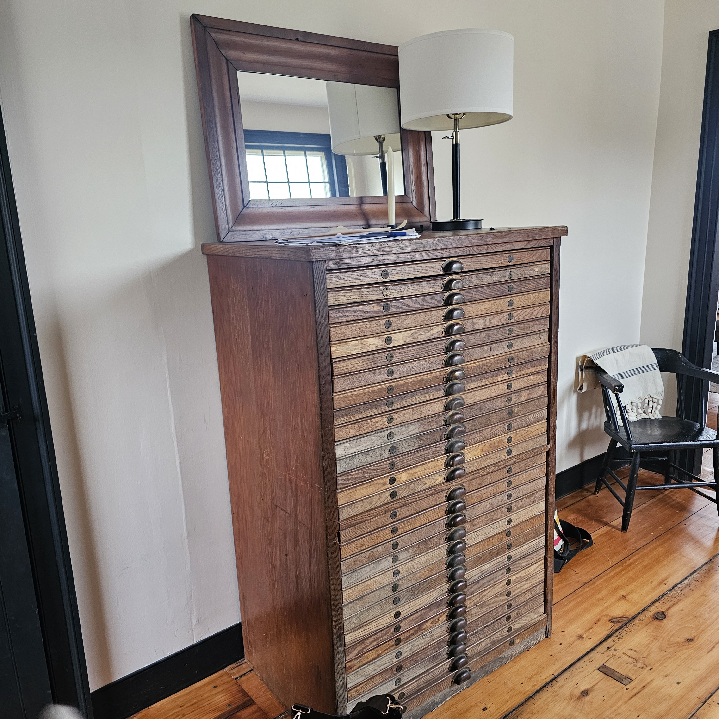 Antique printer's cabinet with mirror