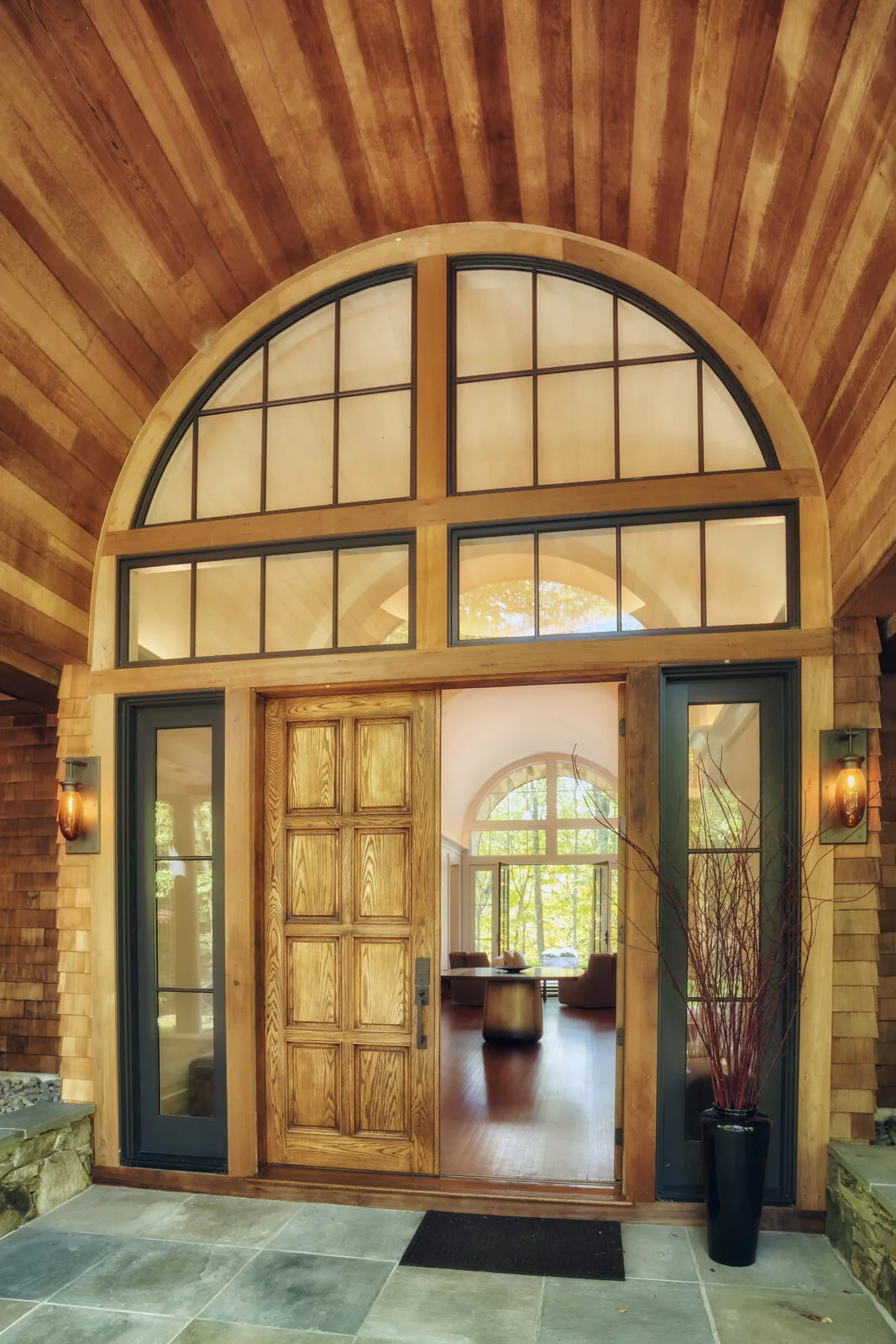 Front door detail under barrel-vaulted portico