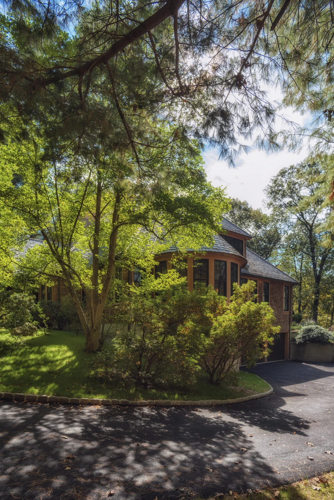 Side elevation with turret bay and driveway